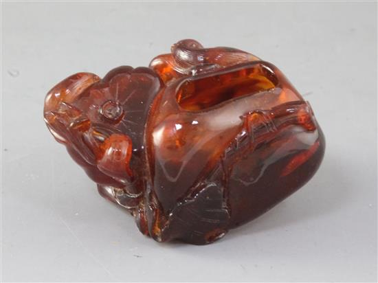 A Chinese amber brushwasher, Qing dynasty, 7cm long